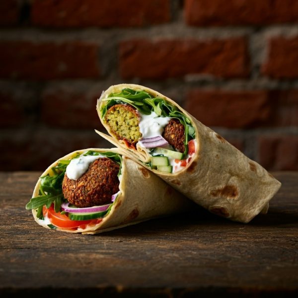 Wrap,Rolled,And,Stuffed,With,Lettuce,,Falafel,,Yogurt,,Arugula,,Tomato,